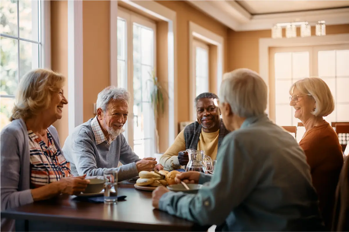 a group of people sitting around a table