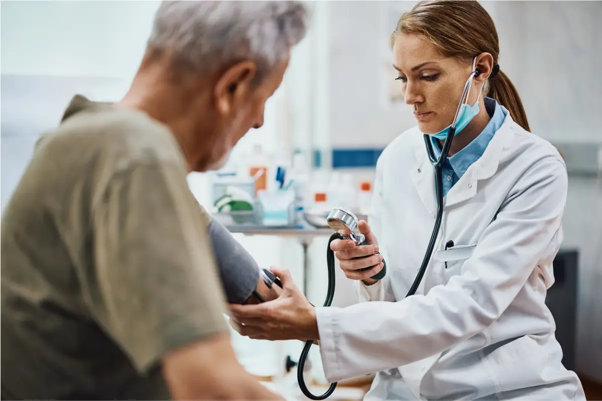 a doctor showing a patient something on the phone