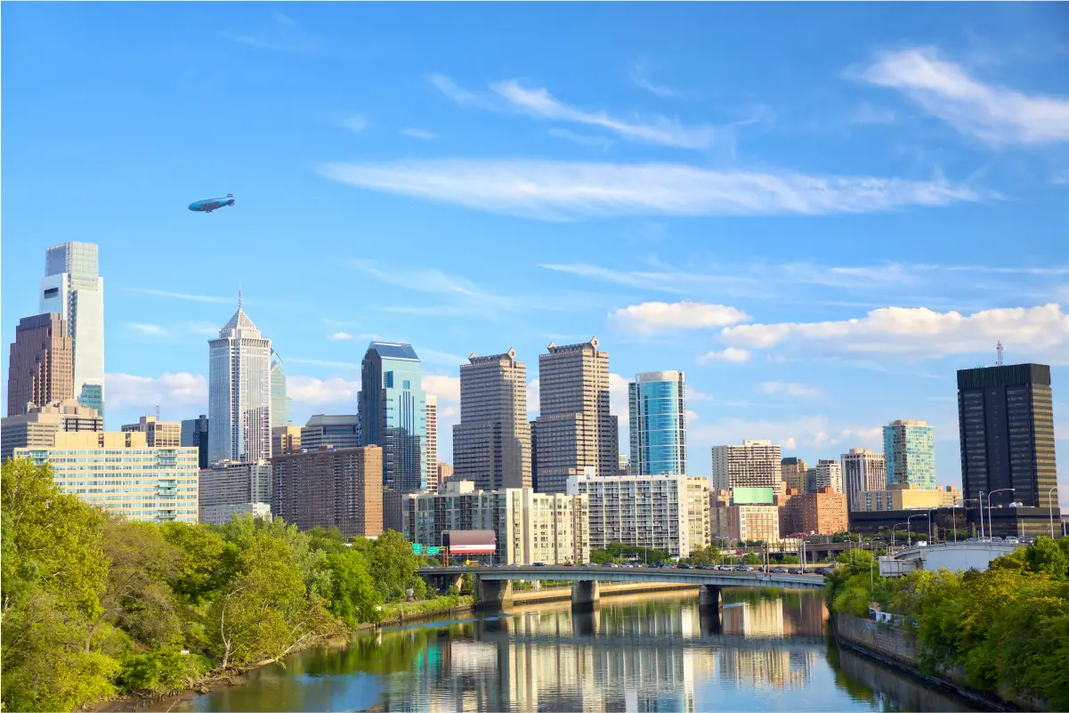 a city skyline with a river