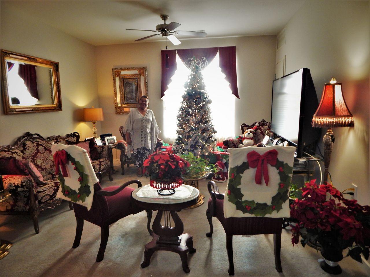 Senior Resident with Christmas Tree In Assisted Living