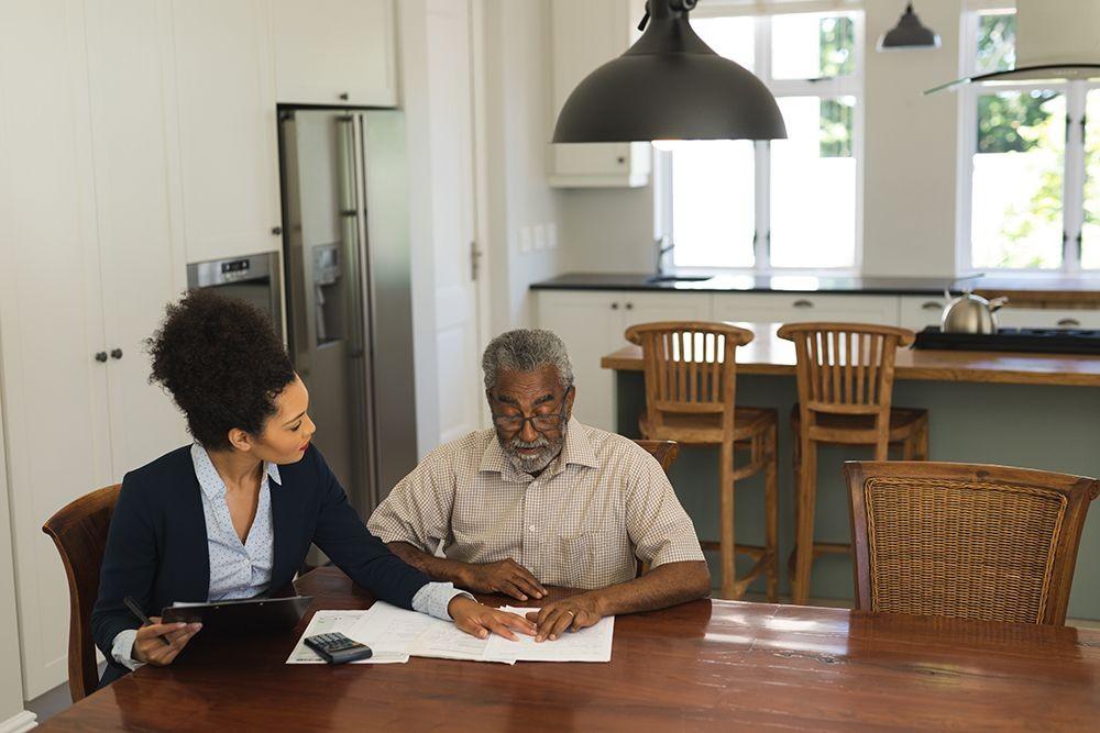 senior-man-and-young-real-estate-agent-discussing-lihtc