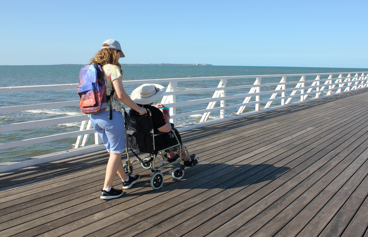 girl pushing her grandma in tampa