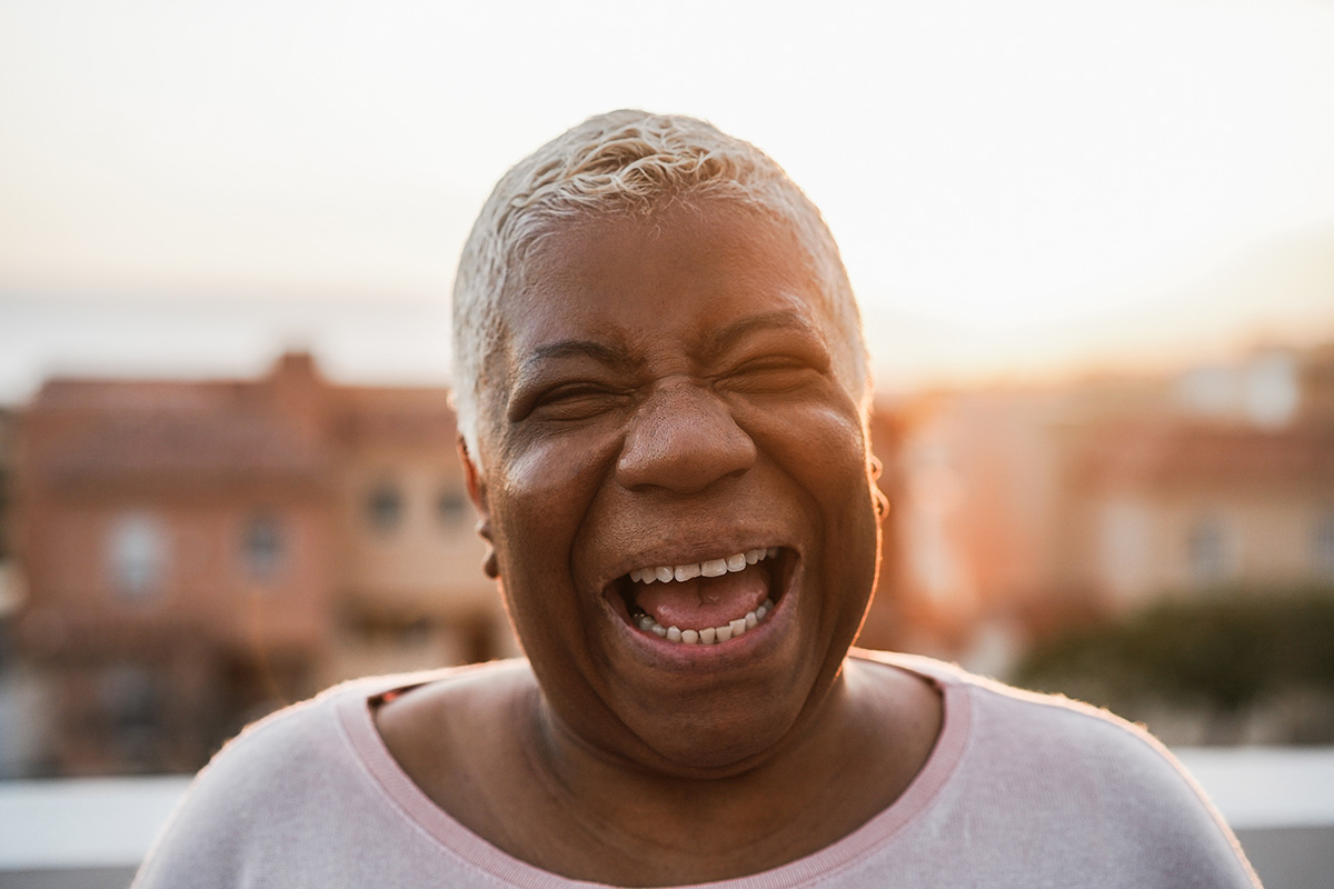 happy senior african woman smiling on camera outdo 2022 01 19 00 09 39 utc