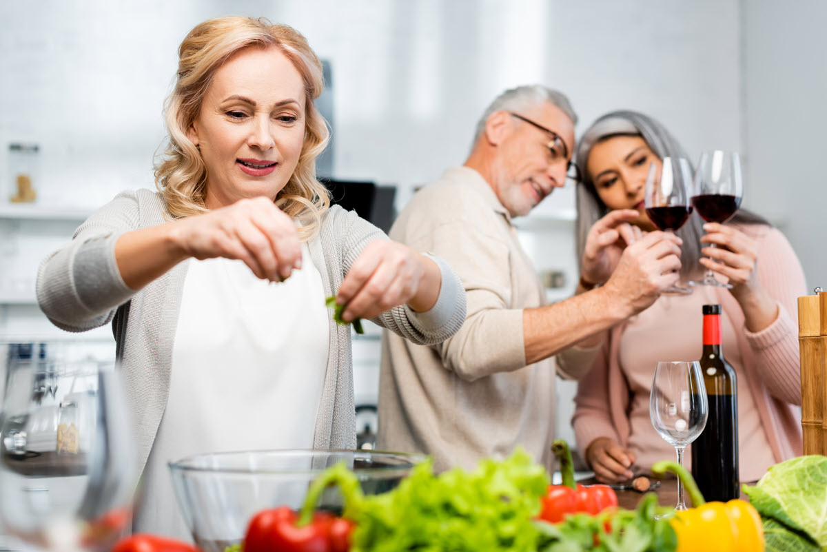 helping senior mom cook