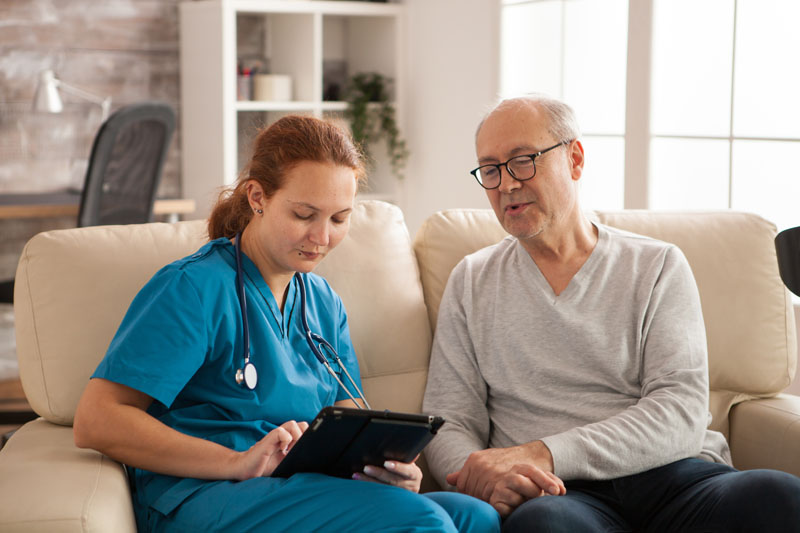 home health nurse getting vital signs