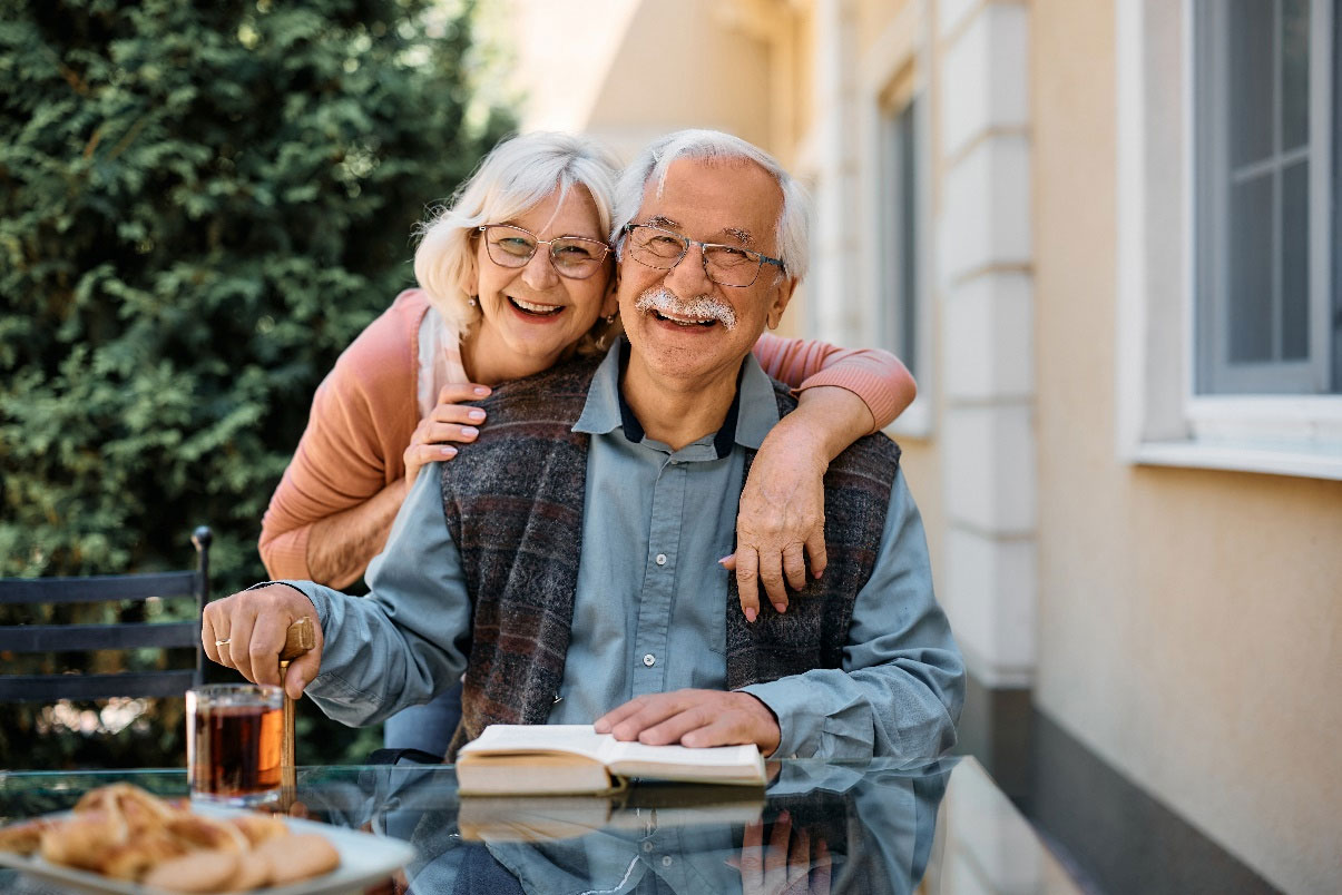 old couple hugging living facilities