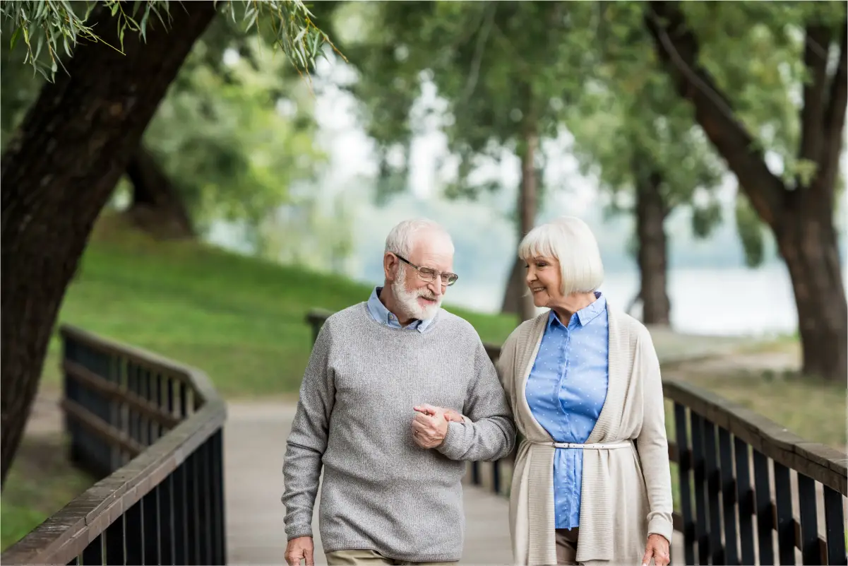 a man and woman standing on a bridge