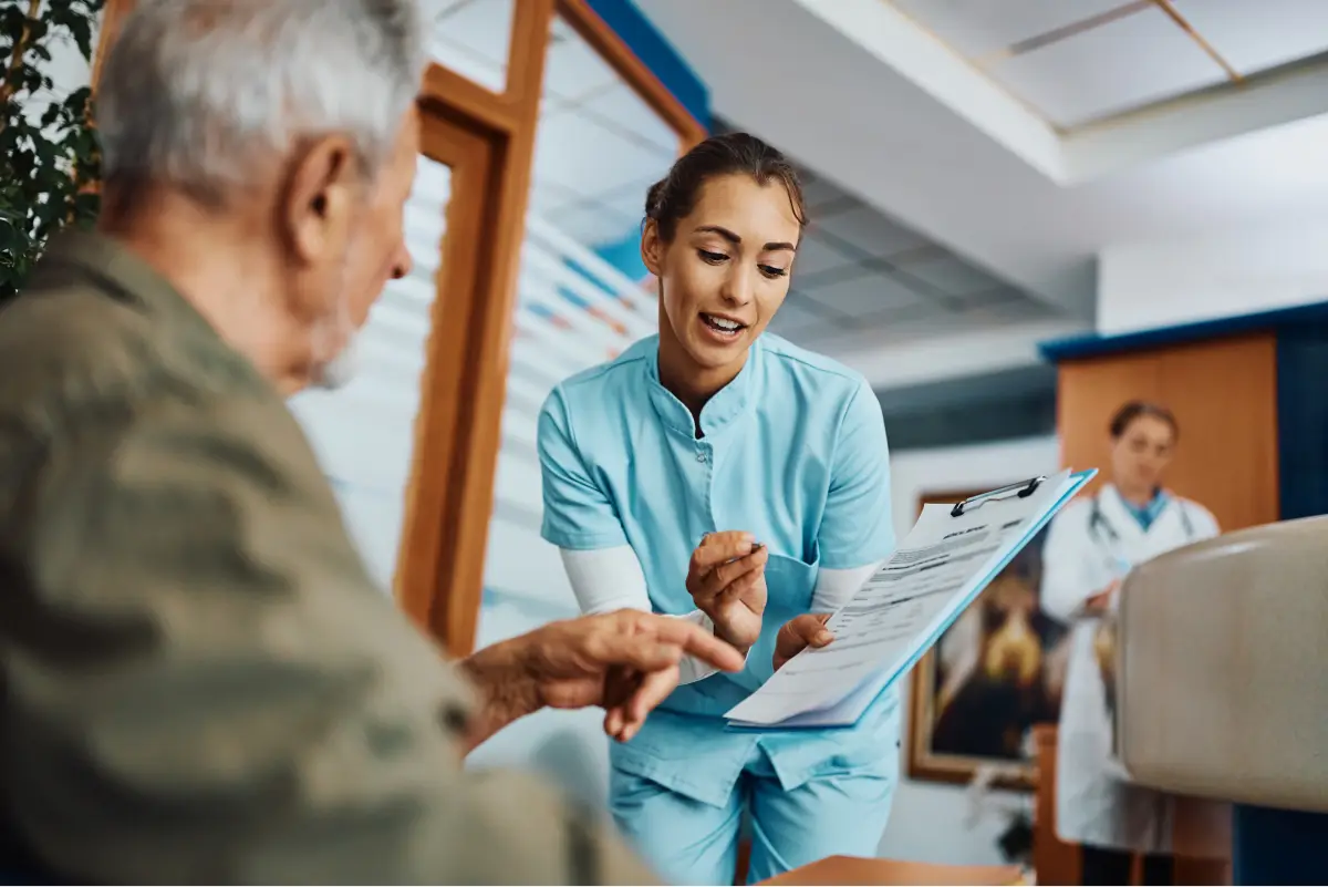 a doctor showing a patient something on the paper