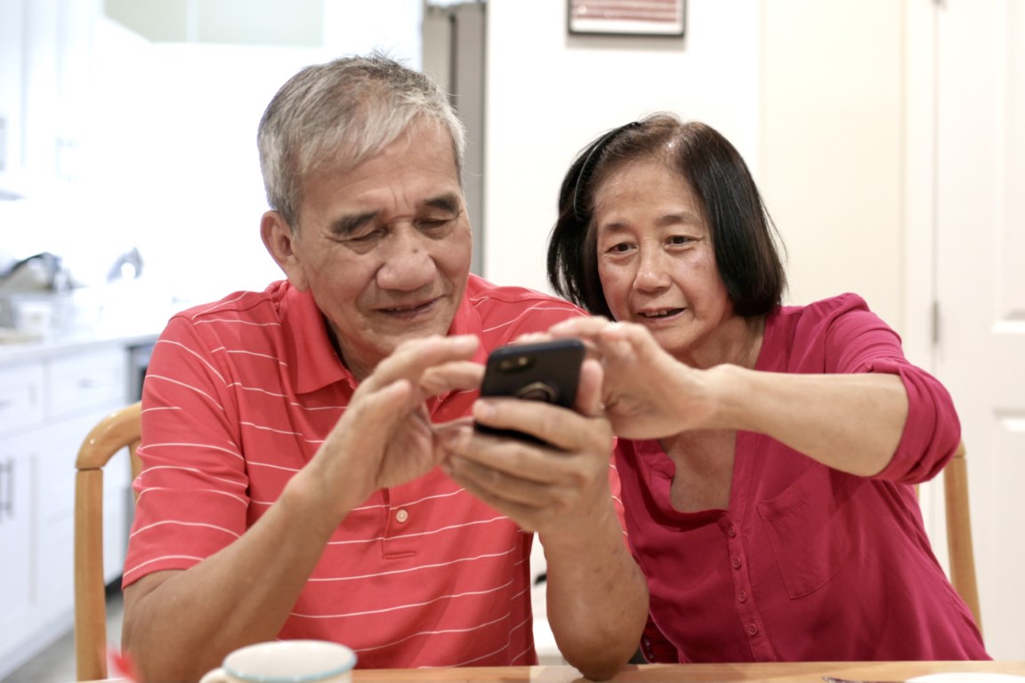 senior Asian couple using a cell phone together 2022 10 31 22 09 25 utc