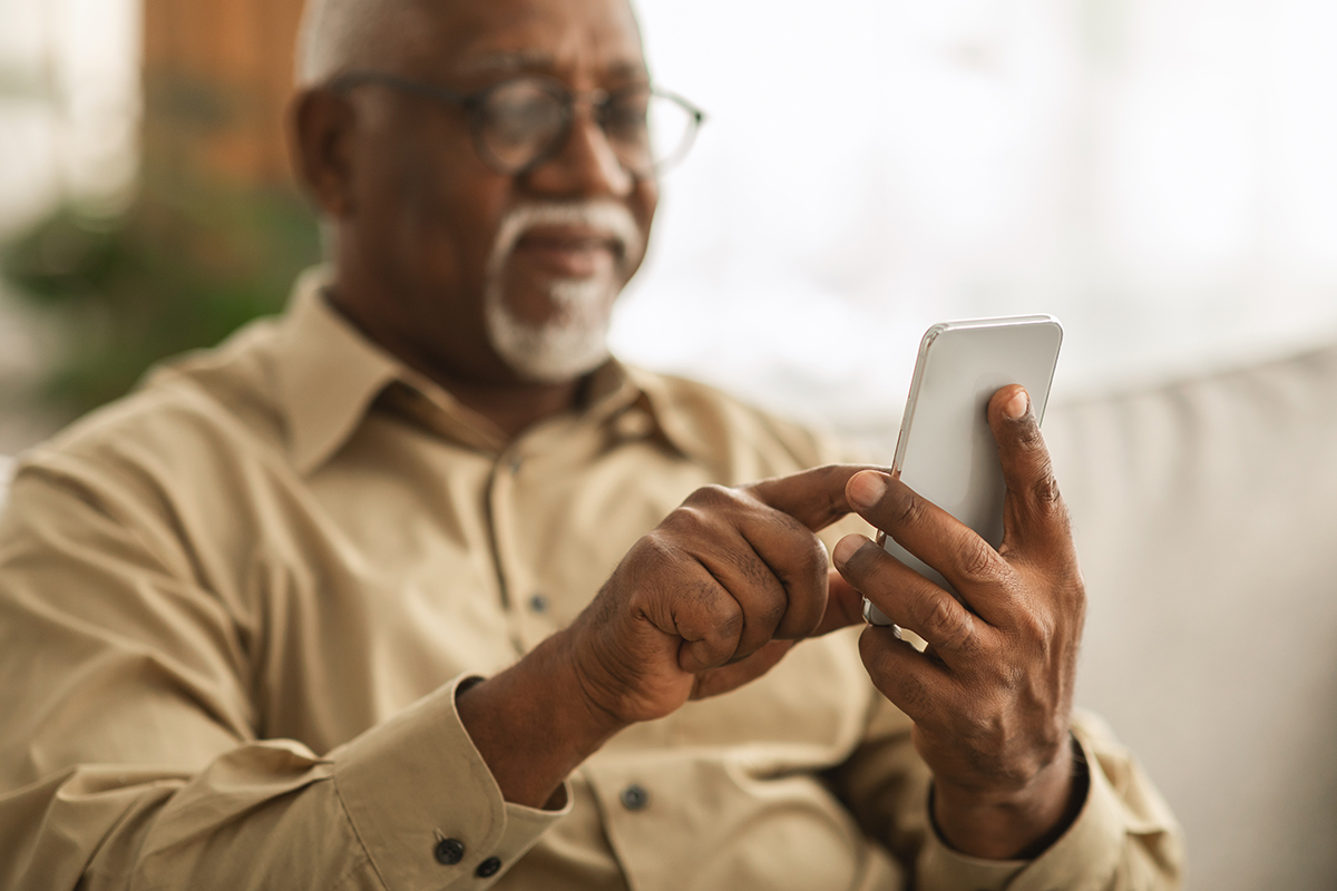 senior man using smartphone