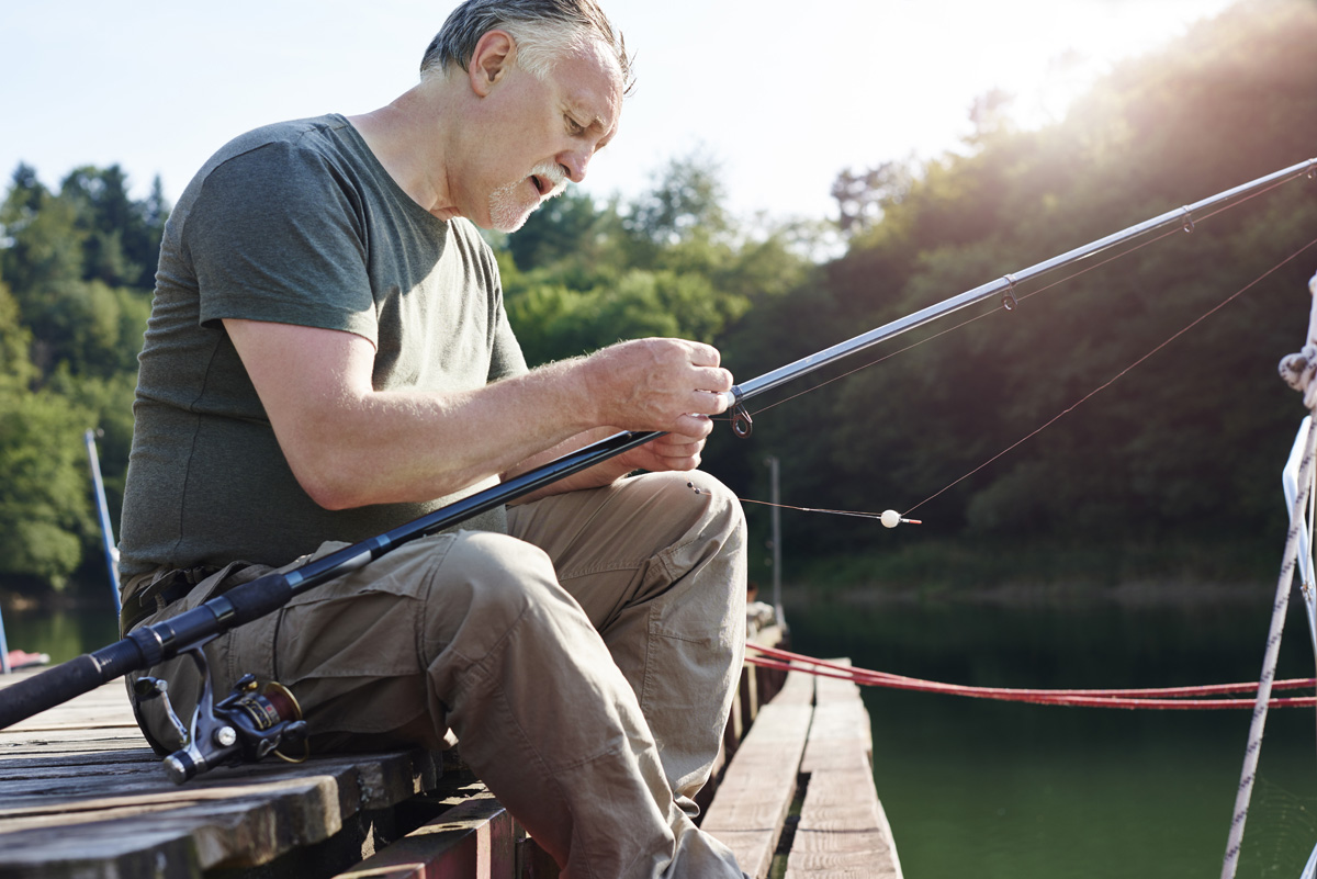 senior men make preparations for fishing in tampa