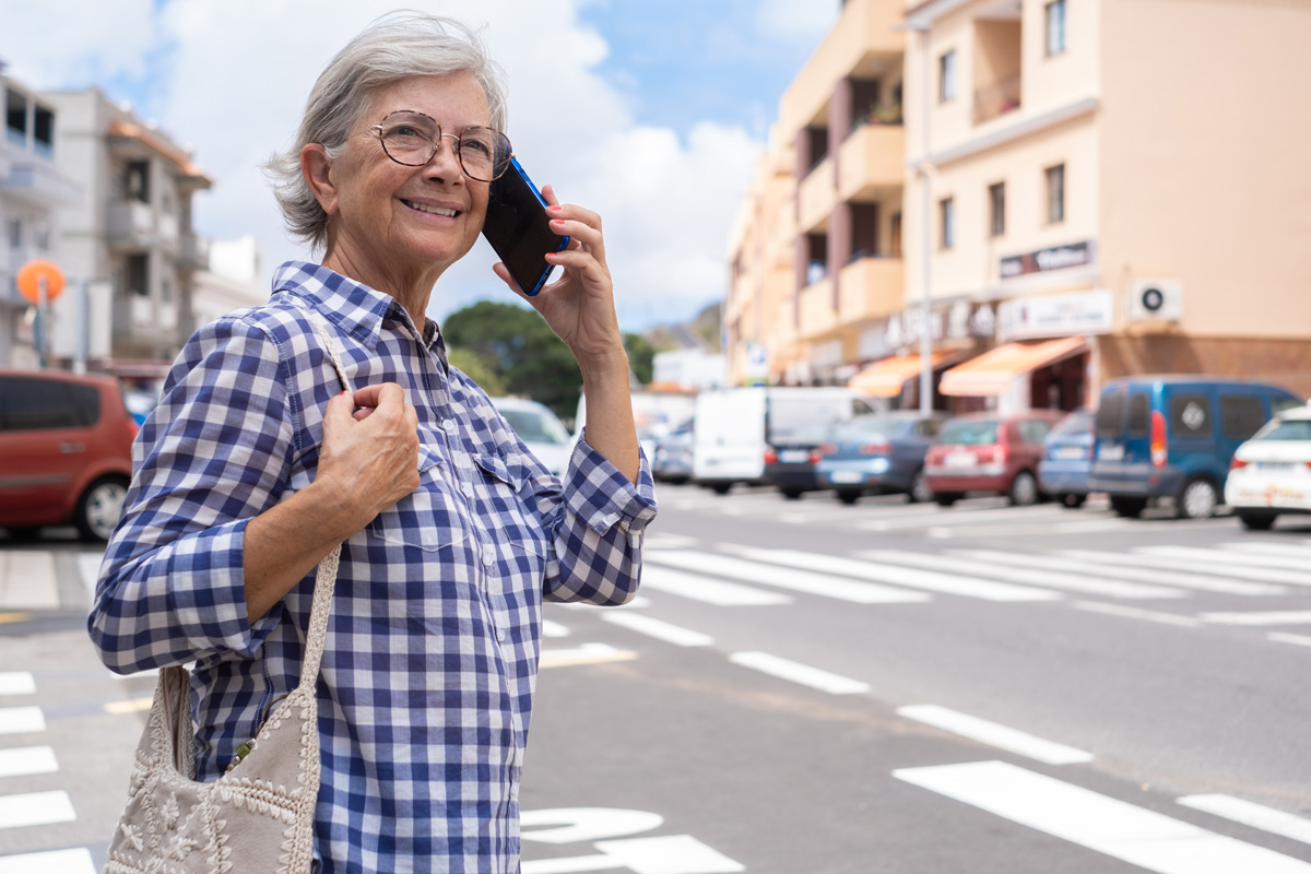 senior woman crossing the street in orlando