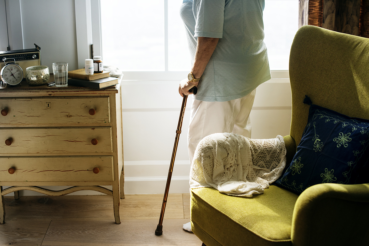 senior woman standing alone in the room